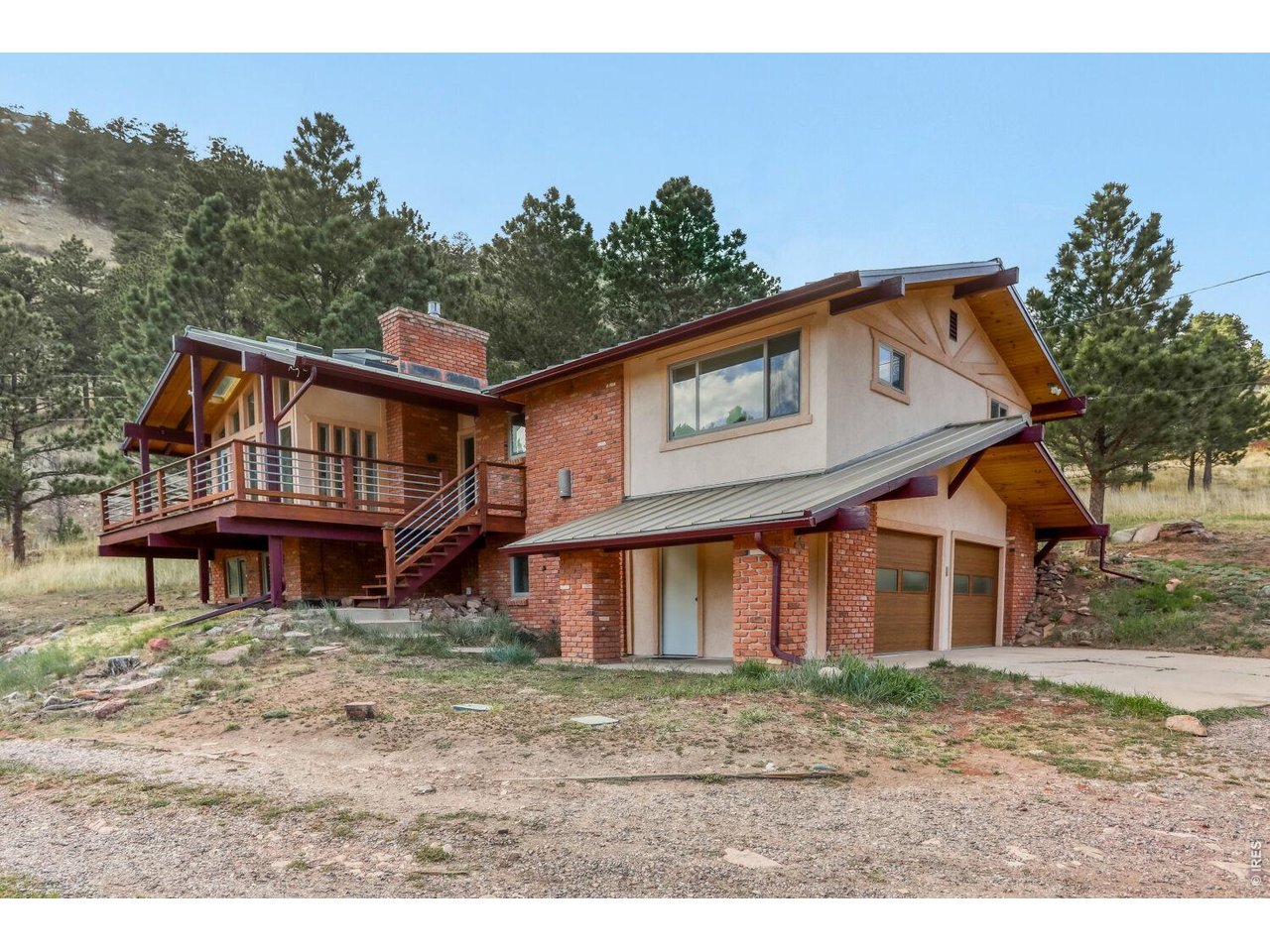 194 North Cedar Brook Road Boulder, CO 80304 - Photo 1 of 30 a front view of a house with garden