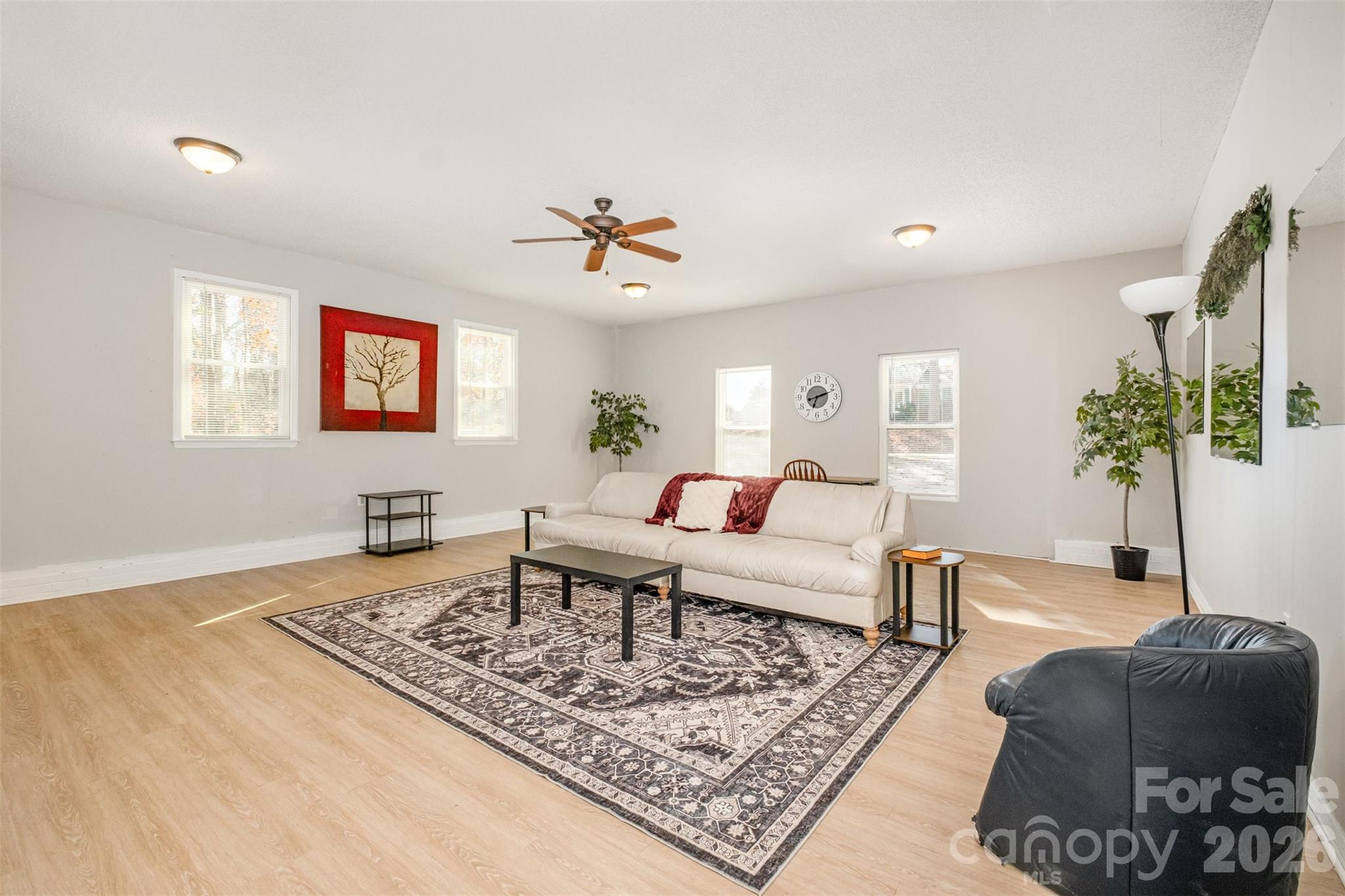 123 General Pemberton Street Stanley, NC 28164 - Photo 15 of 32 a living room with furniture and a potted plant