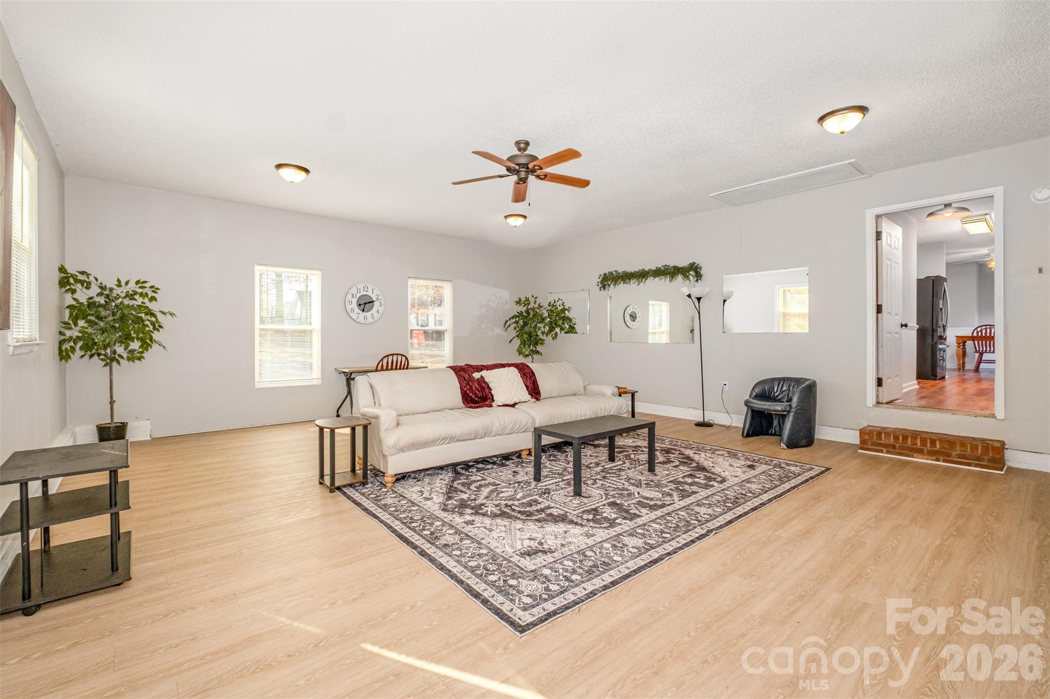 123 General Pemberton Street Stanley, NC 28164 - Photo 16 of 32 a living room with furniture and a potted plant