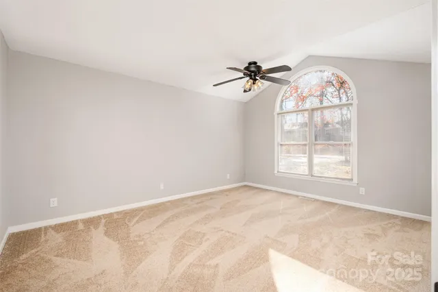 a view of room with ceiling fan