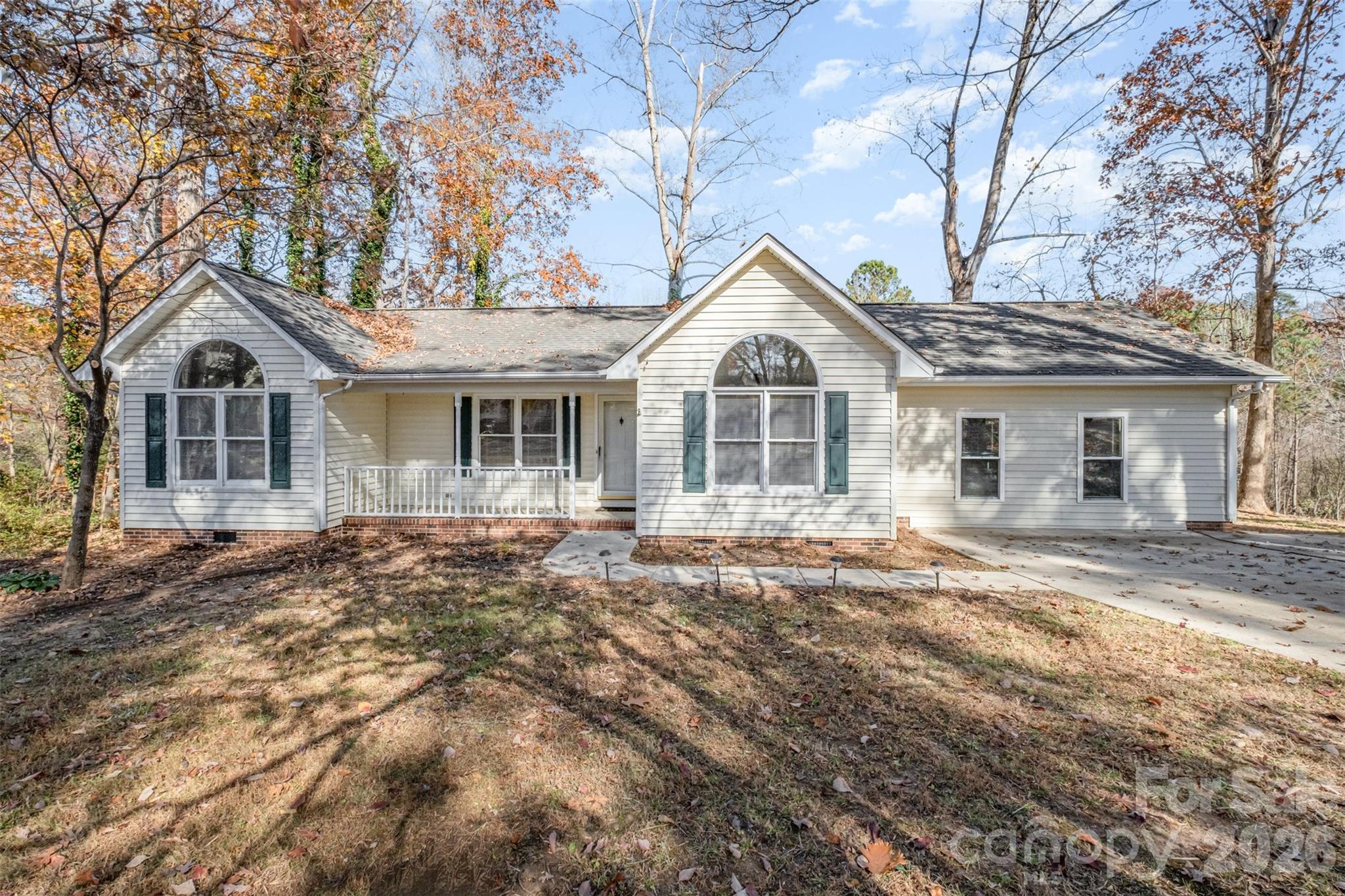123 General Pemberton Street Stanley, NC 28164 - Photo 2 of 32 a front view of a house with a garden