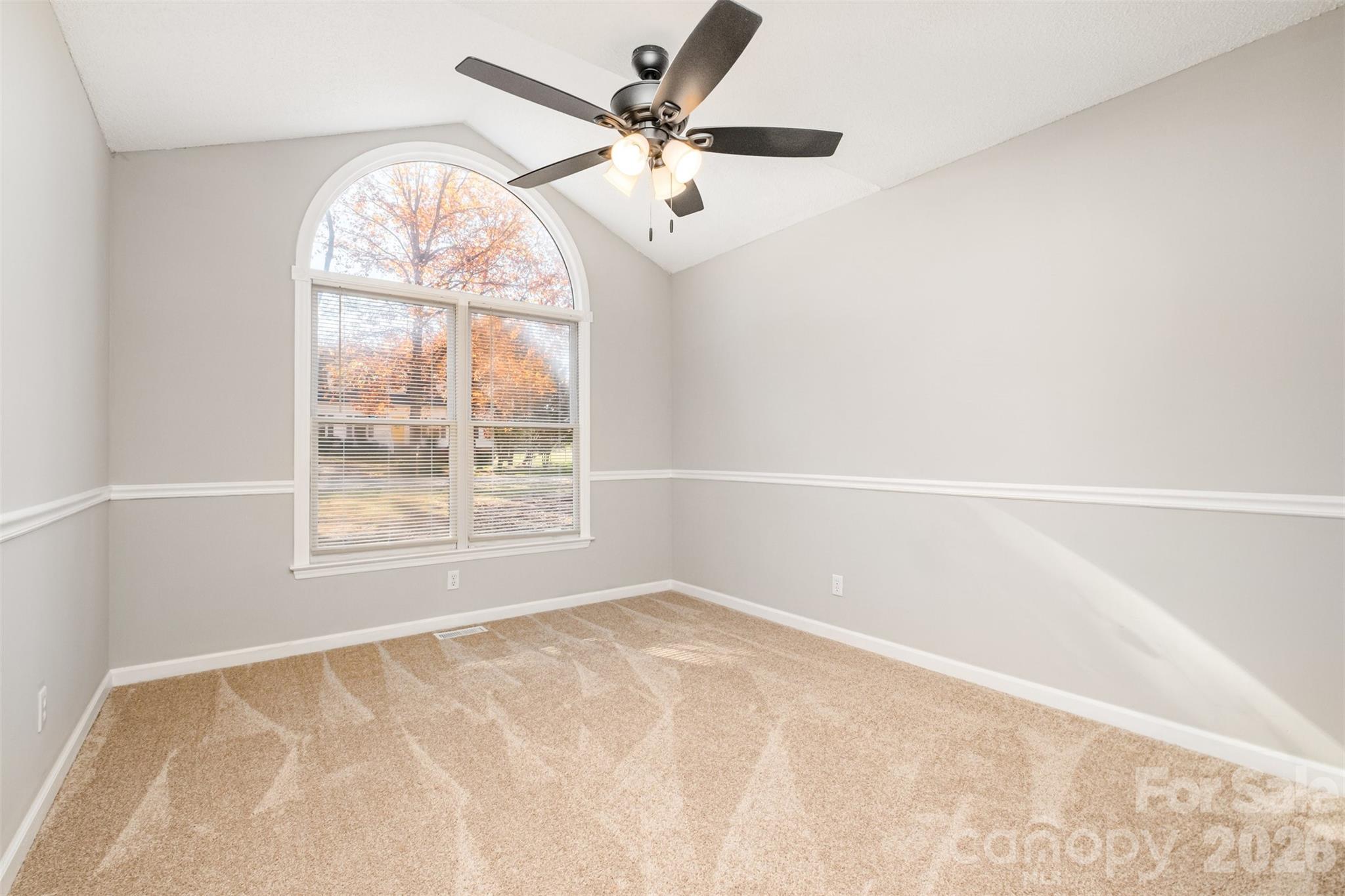 123 General Pemberton Street Stanley, NC 28164 - Photo 22 of 32 an empty room with a window and a fan