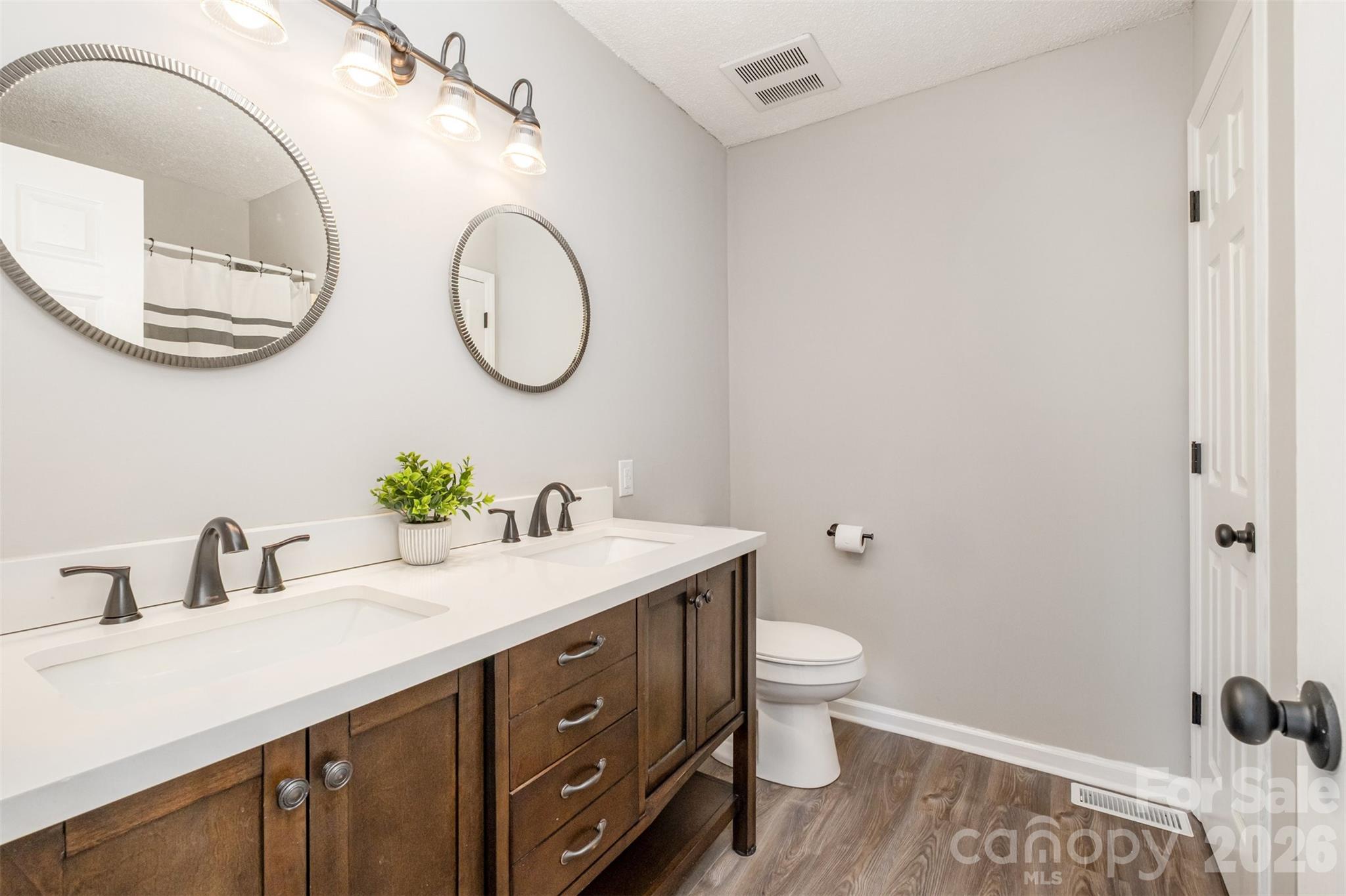 123 General Pemberton Street Stanley, NC 28164 - Photo 23 of 32 a bathroom with a granite countertop sink and a mirror
