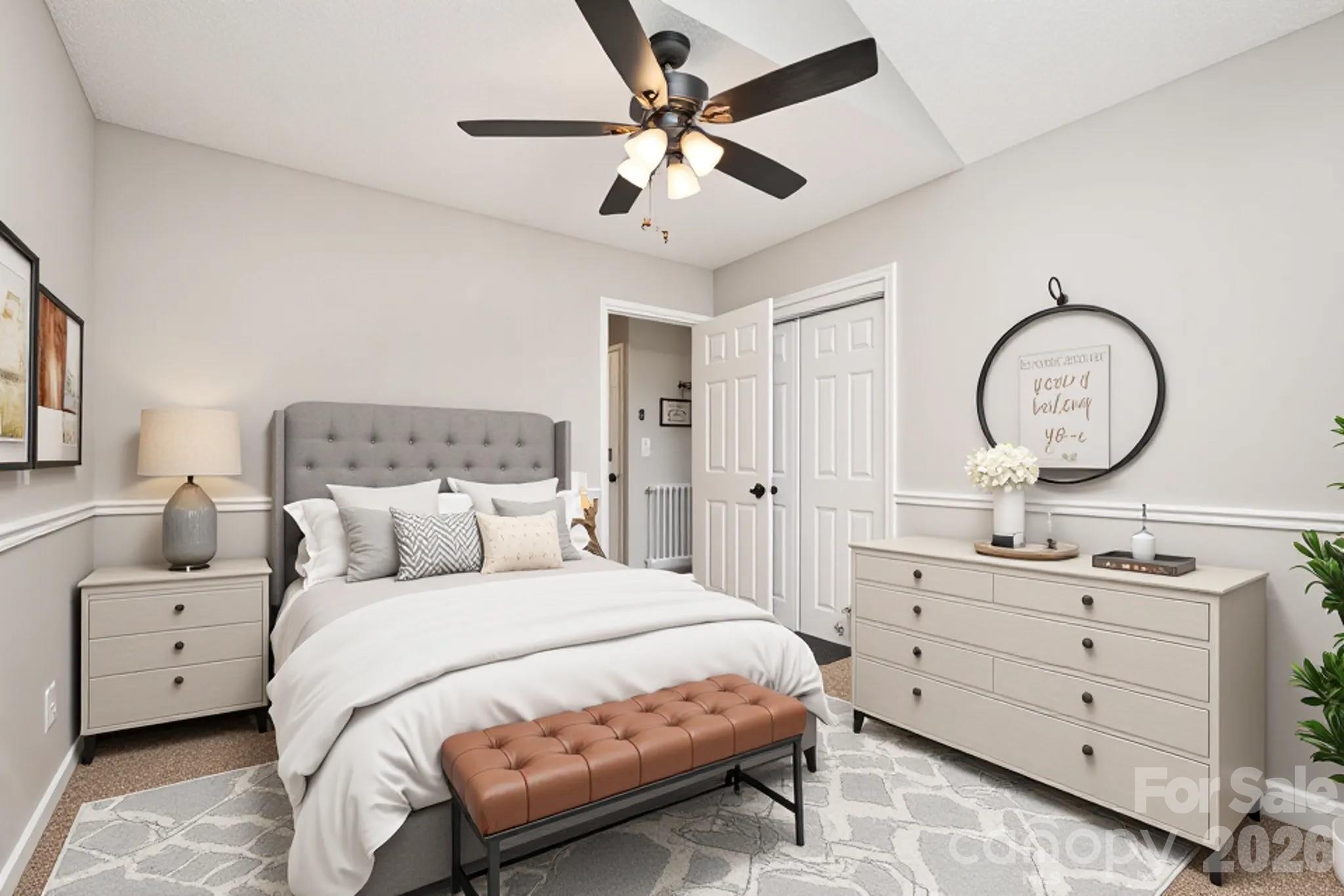 123 General Pemberton Street Stanley, NC 28164 - Photo 24 of 32 a bedroom with a large bed and a chandelier