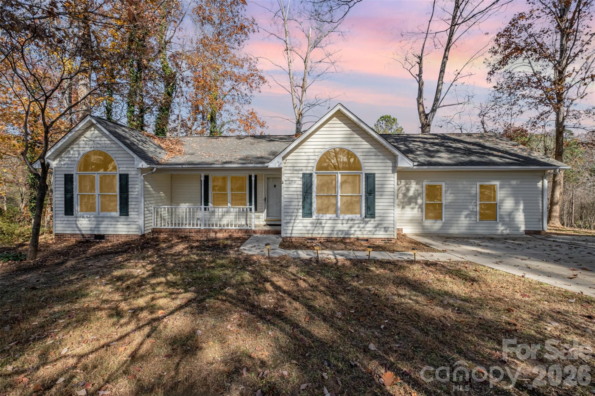 123 General Pemberton Street Stanley, NC 28164 - Photo 31 of 32 a front view of a house with a garden