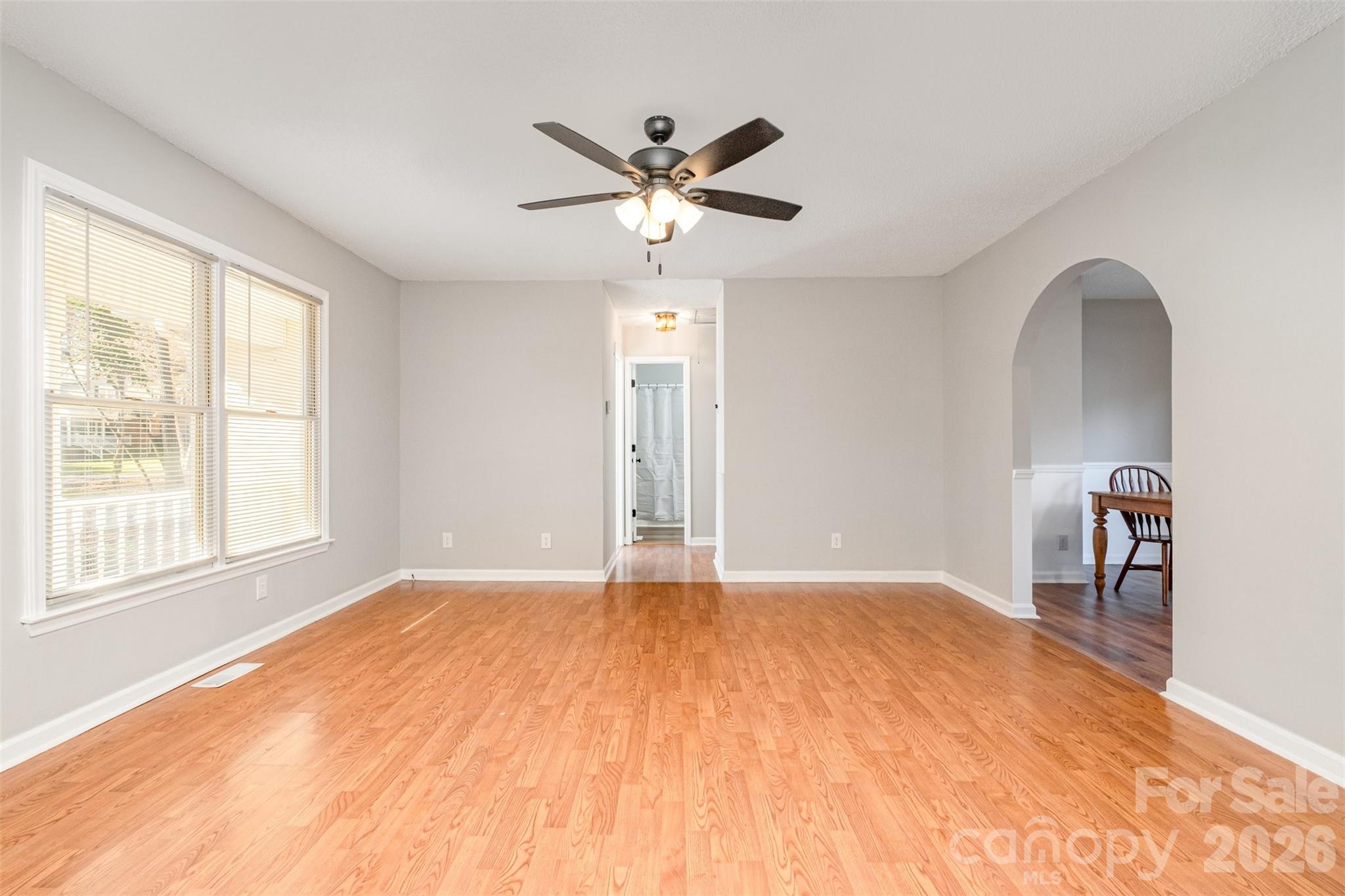 123 General Pemberton Street Stanley, NC 28164 - Photo 5 of 32 a view of a livingroom with a ceiling fan and window