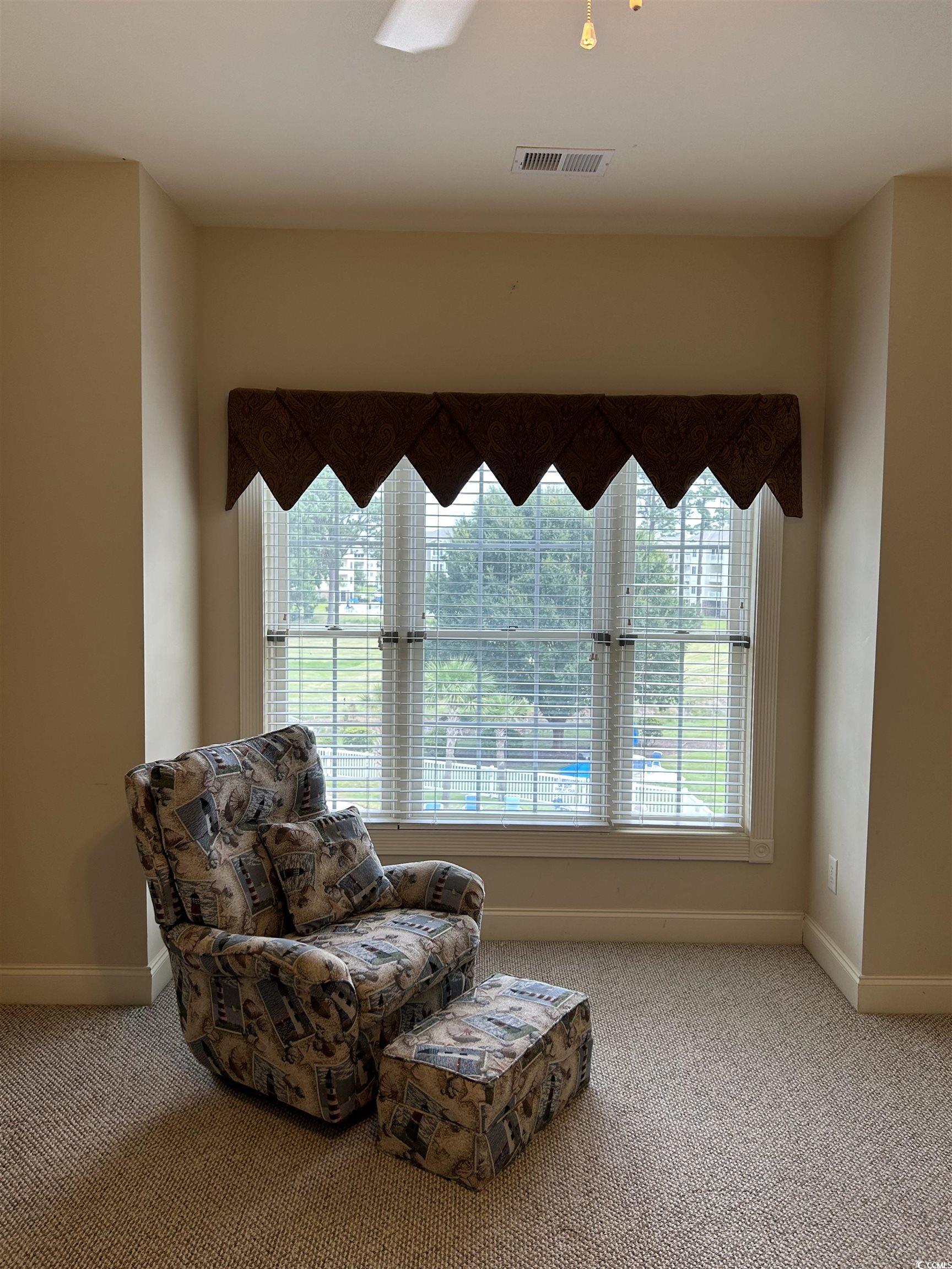 4893 Magnolia Pointe Lane, Unit 305 Myrtle Beach, SC 29577 - Photo 16 of 36 Sitting room featuring carpet floors