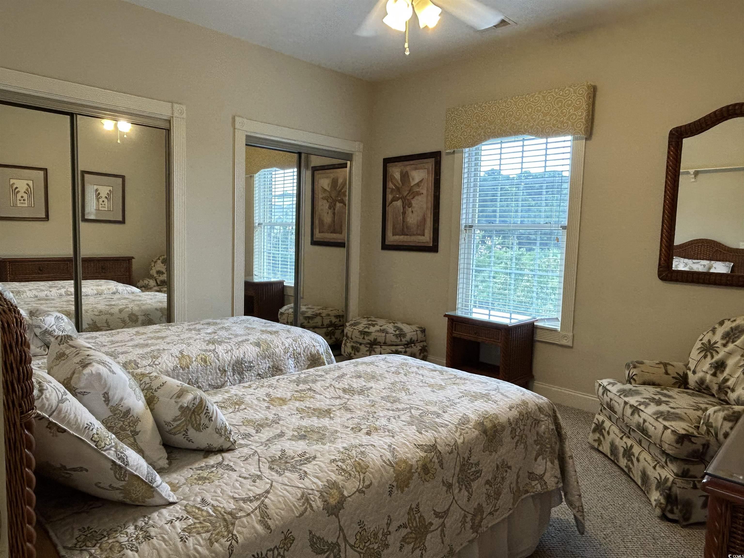 4893 Magnolia Pointe Lane, Unit 305 Myrtle Beach, SC 29577 - Photo 18 of 36 Bedroom with carpet and ceiling fan