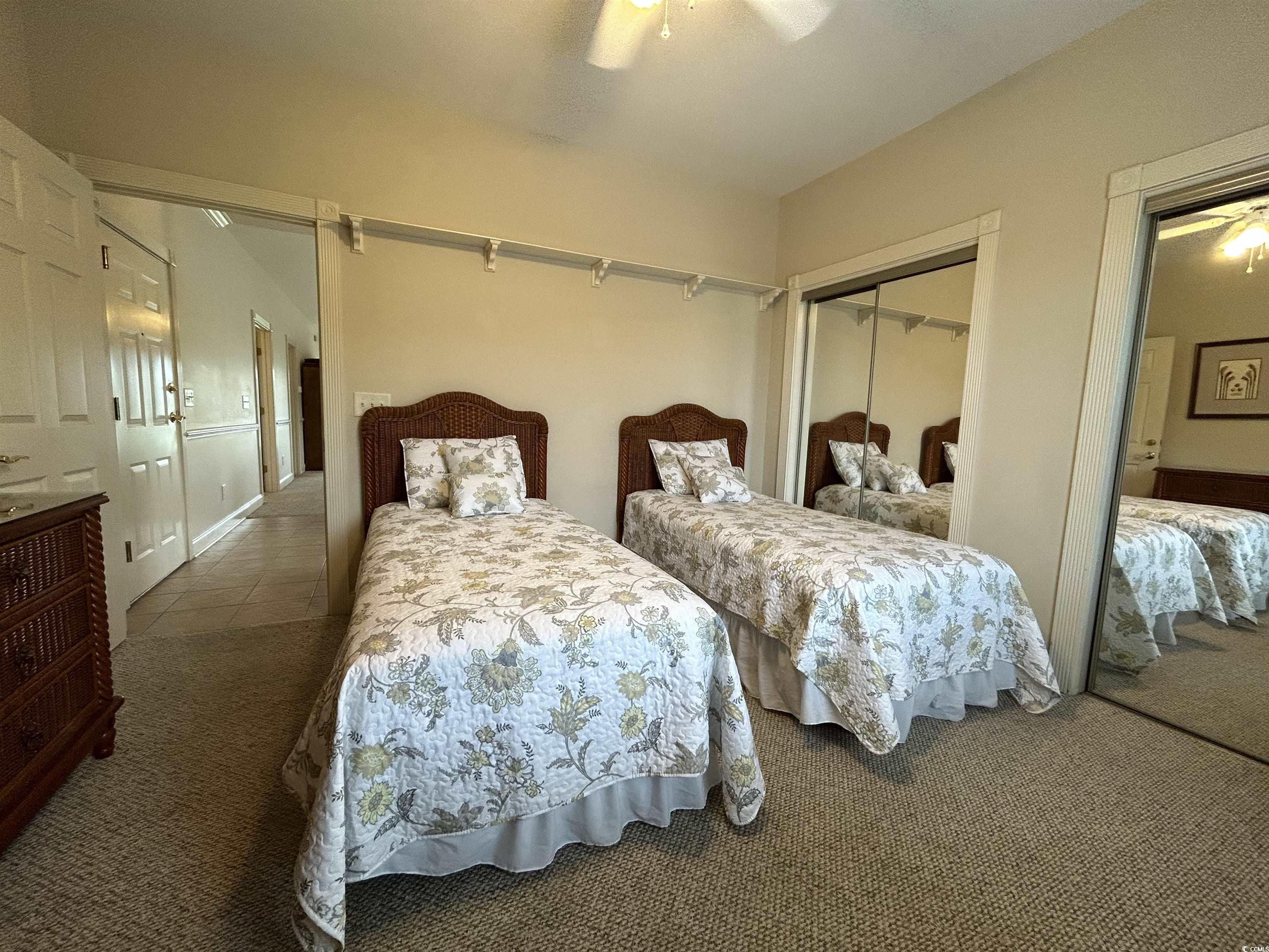 4893 Magnolia Pointe Lane, Unit 305 Myrtle Beach, SC 29577 - Photo 21 of 36 Carpeted bedroom with ceiling fan and a closet