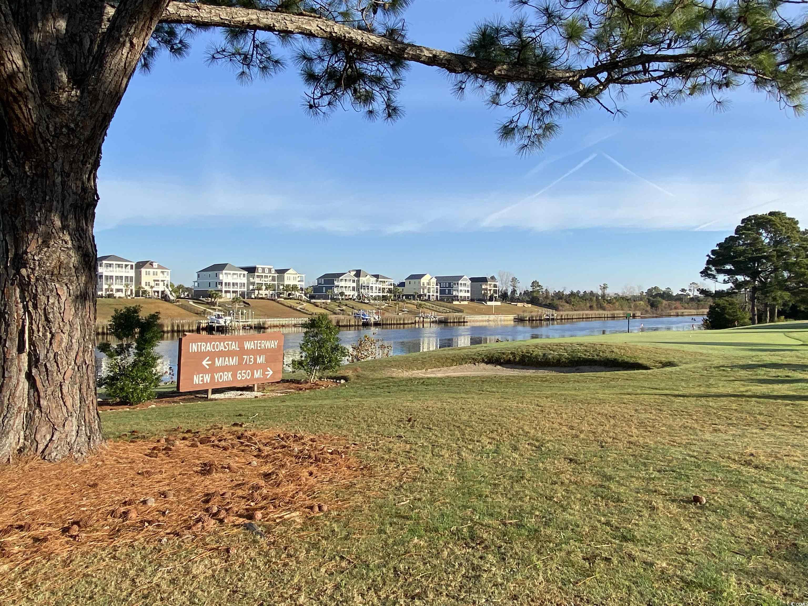 4893 Magnolia Pointe Lane, Unit 305 Myrtle Beach, SC 29577 - Photo 26 of 36 View of yard with a water view