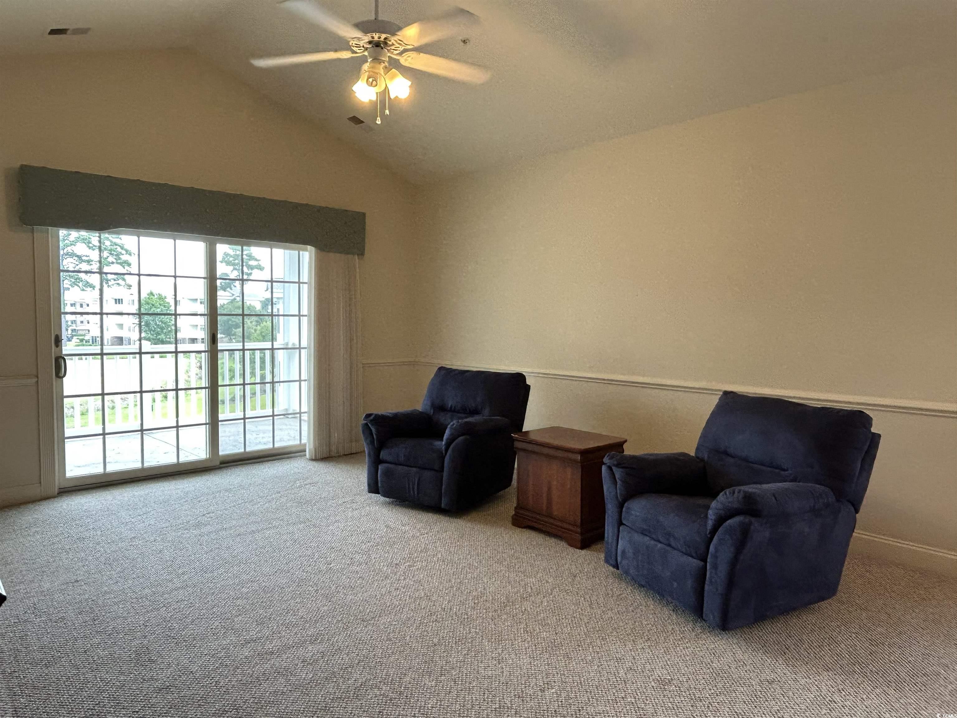 4893 Magnolia Pointe Lane, Unit 305 Myrtle Beach, SC 29577 - Photo 8 of 36 Sitting room with carpet flooring, ceiling fan, and lofted ceiling