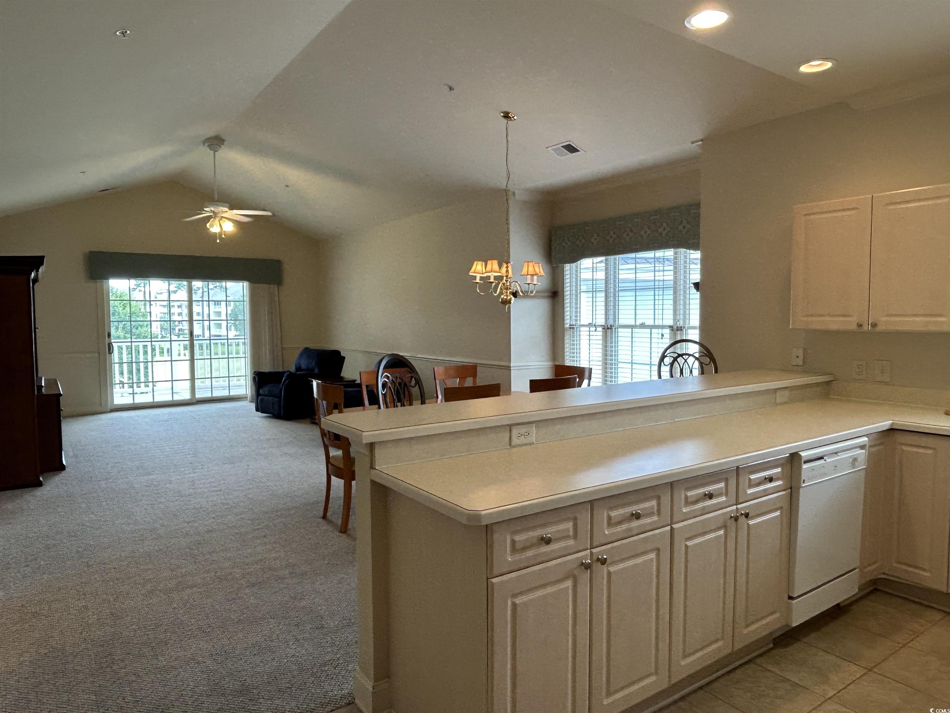 4893 Magnolia Pointe Lane, Unit 305 Myrtle Beach, SC 29577 - Photo 10 of 36 Kitchen featuring kitchen peninsula, dishwasher, and plenty of natural light