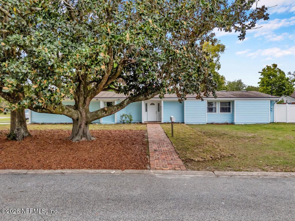 892 Trinidad Road Jacksonville, FL 32216 - Photo 1 of 37 a front view of house with yard and trees