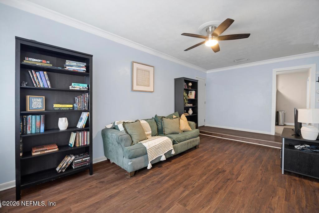 892 Trinidad Road Jacksonville, FL 32216 - Photo 13 of 37 a living room with furniture and a wooden floor