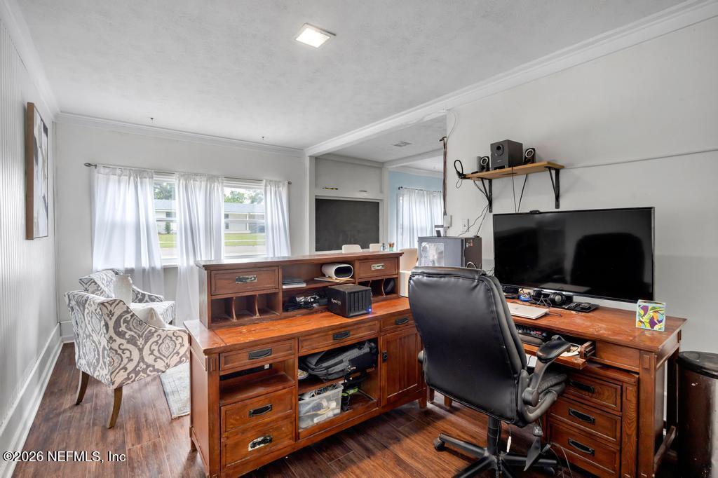 892 Trinidad Road Jacksonville, FL 32216 - Photo 19 of 37 a view of a livingroom with workspace and a window