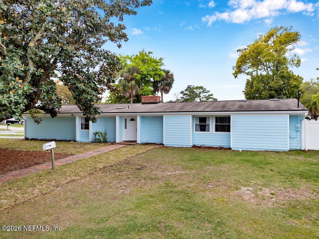 892 Trinidad Road Jacksonville, FL 32216 - Photo 2 of 37 a view of a house with a yard and potted plants