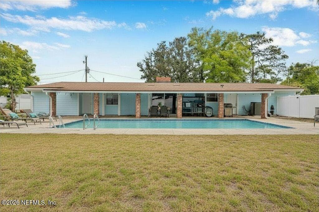892 Trinidad Road Jacksonville, FL 32216 - Photo 3 of 37 a front view of a house with swimming pool