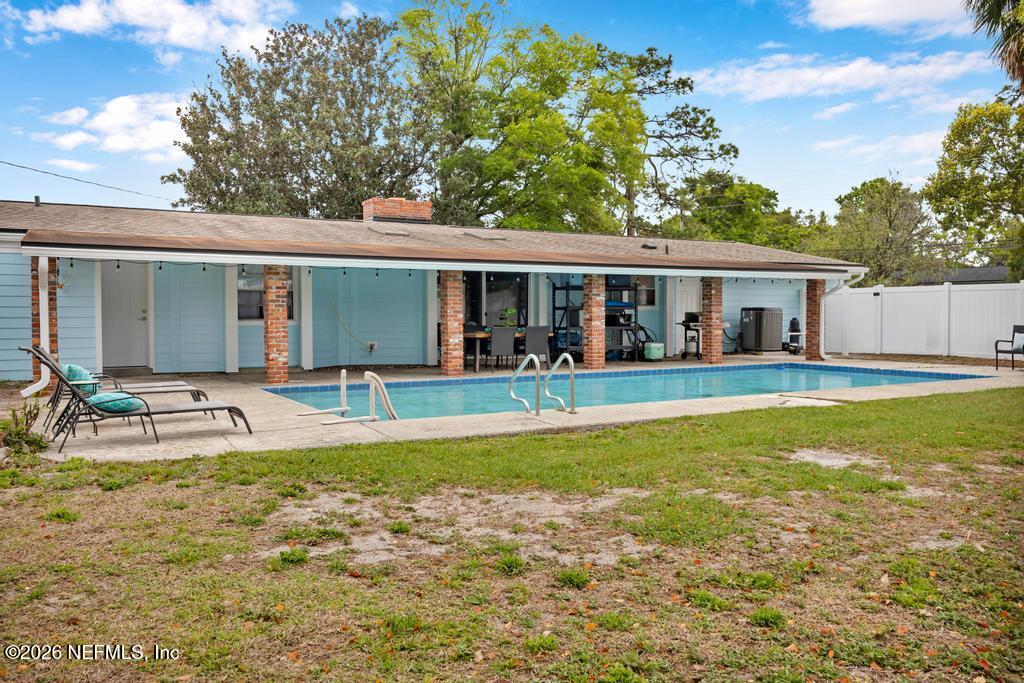 892 Trinidad Road Jacksonville, FL 32216 - Photo 33 of 37 a view of a house with swimming pool and porch