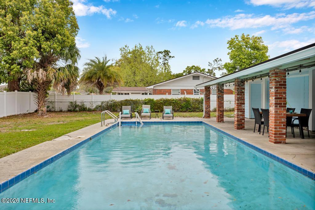 892 Trinidad Road Jacksonville, FL 32216 - Photo 34 of 37 a view of a house with swimming pool and sitting area