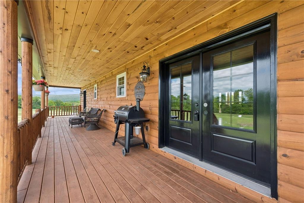 394 Mountain View Road New Florence, PA 15944 - Photo 5 of 37 a view of a balcony with chairs and wooden floor