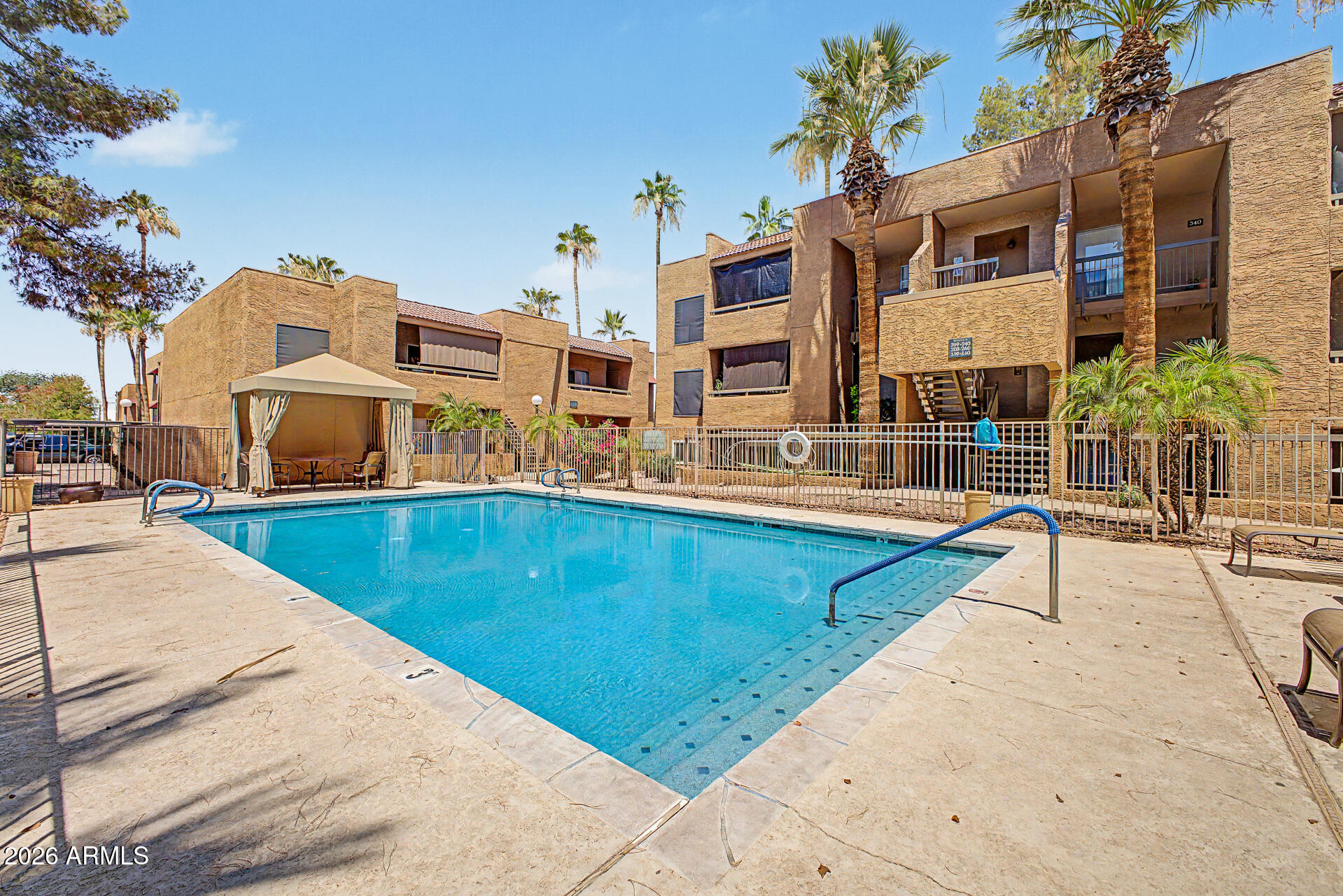 2625 East Indian School Road, Unit 227 Phoenix, AZ 85016 - Photo 26 of 31 a view of a building with a swimming pool