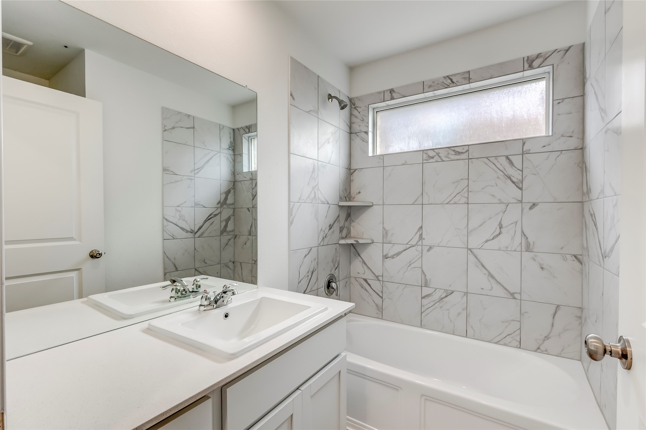 591 Avre Loop Kyle, TX 78640 - Photo 27 of 34 a bathroom with a sink and a mirror
