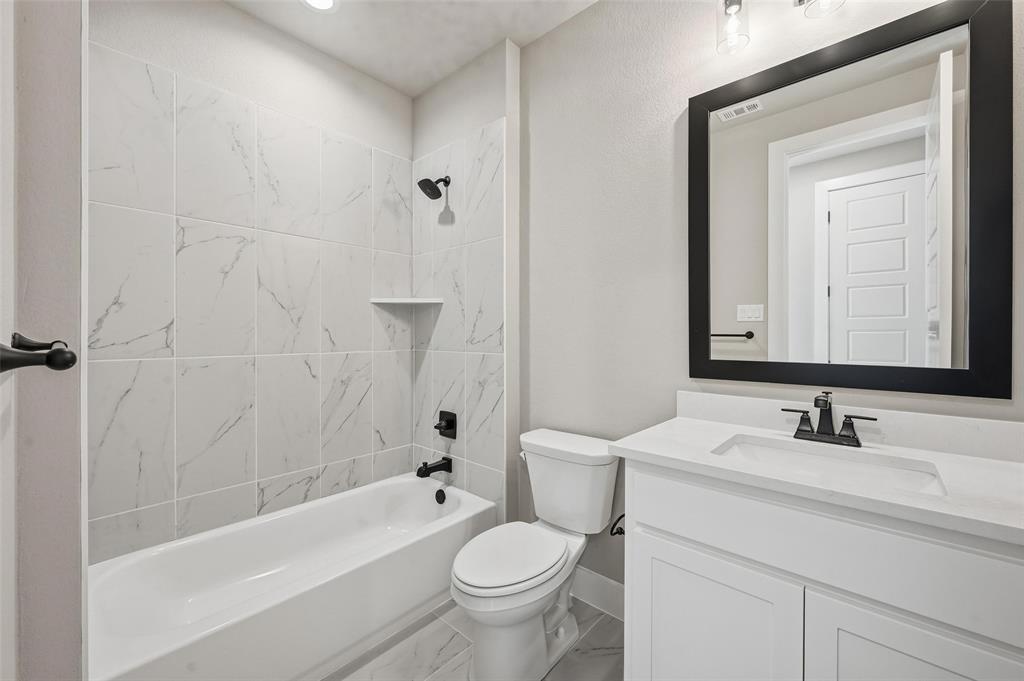 1053 Llano Way Poolville, TX 76487 - Photo 34 of 40 a bathroom with a sink toilet and shower