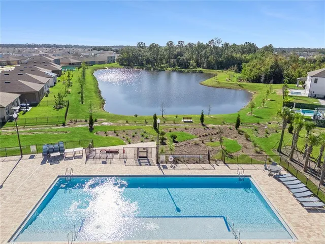 an aerial view of a city with lawn chairs