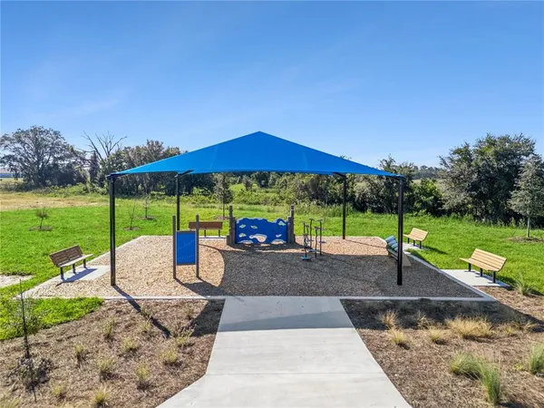 a view of park with a slide