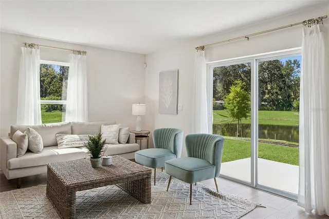 a living room with furniture and a window