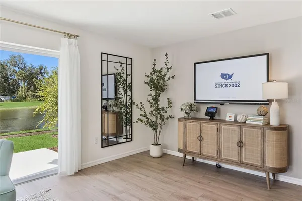 a view of an entryway with wooden floor