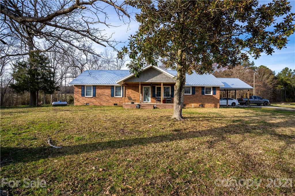 5743 Camp Creek Road Lancaster, SC 29720 - Photo 2 of 20 a front view of a house with garden