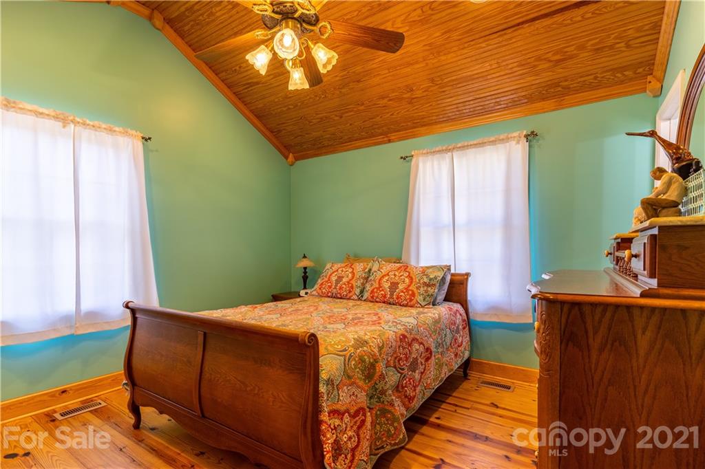 5743 Camp Creek Road Lancaster, SC 29720 - Photo 11 of 20 a bedroom with a bed and windows