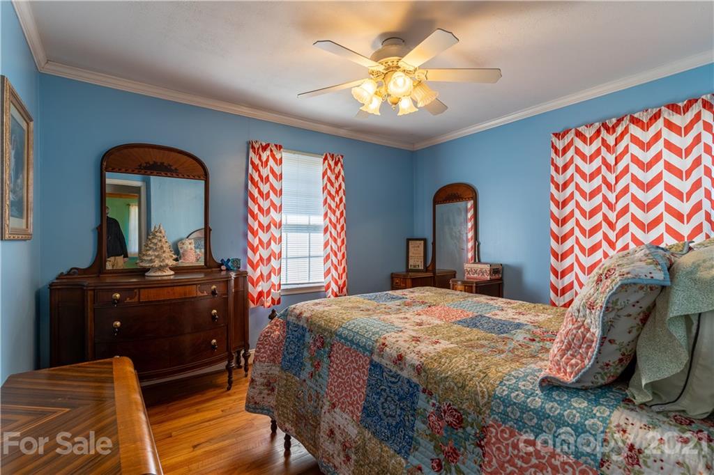 5743 Camp Creek Road Lancaster, SC 29720 - Photo 16 of 20 a bedroom with a bed and a dresser