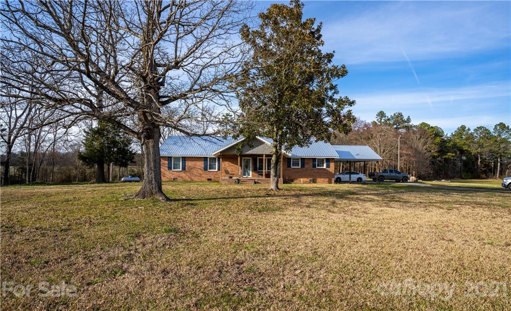 5743 Camp Creek Road Lancaster, SC 29720 - Photo 3 of 20 a view of a house with a yard