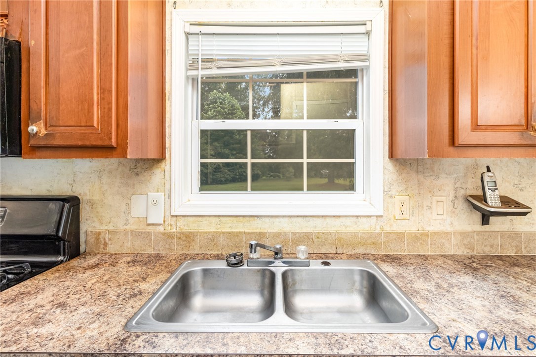 1292 Mt Prospect Road Laneview, VA 22504 - Photo 8 of 25 a kitchen with a sink and a window