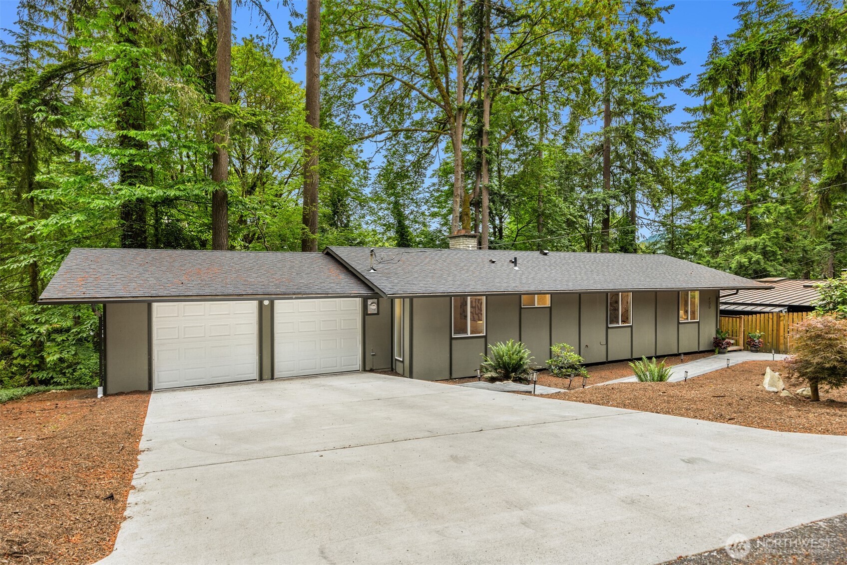 400 Southwest Forest Place Issaquah, WA 98027 - Photo 24 of 24 a front view of a house with a garden