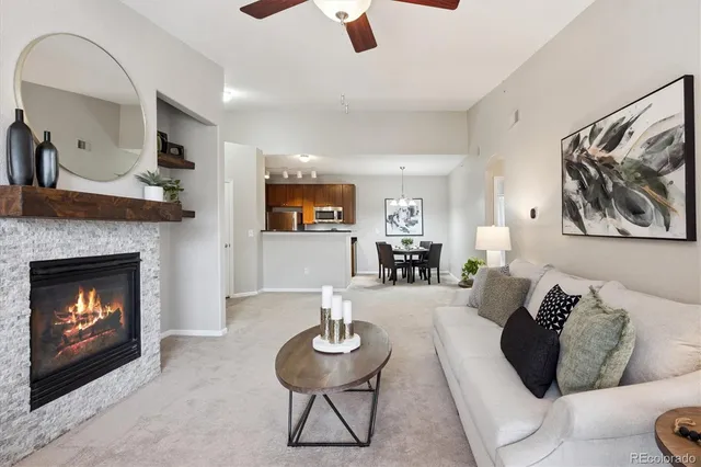 a living room with a fireplace and a fireplace