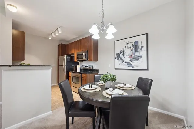a kitchen with stainless steel appliances granite countertop a sink stove microwave and cabinets