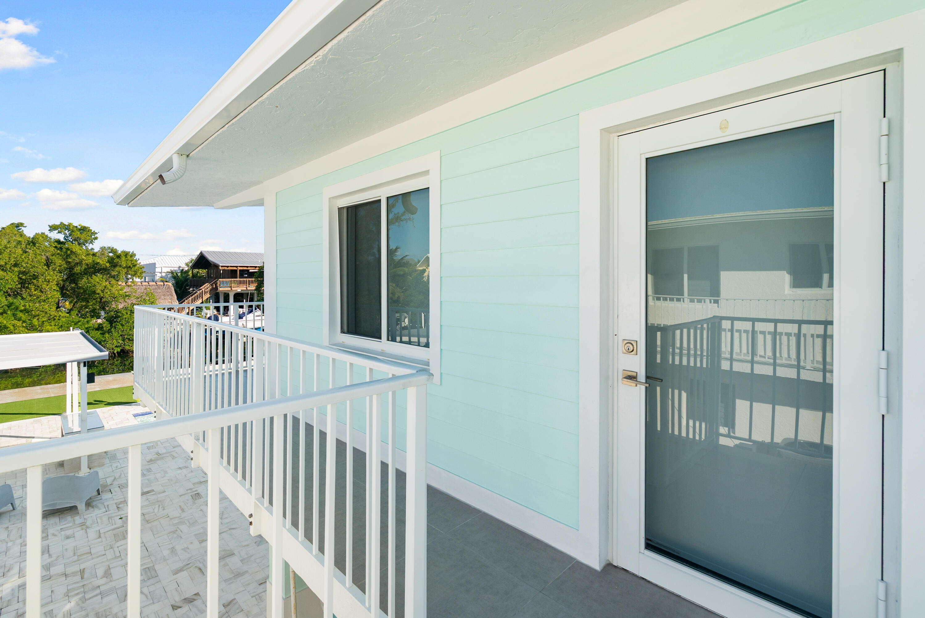 204 La Paloma Road Key Largo, FL 33037 - Photo 12 of 35 a view of a balcony from door