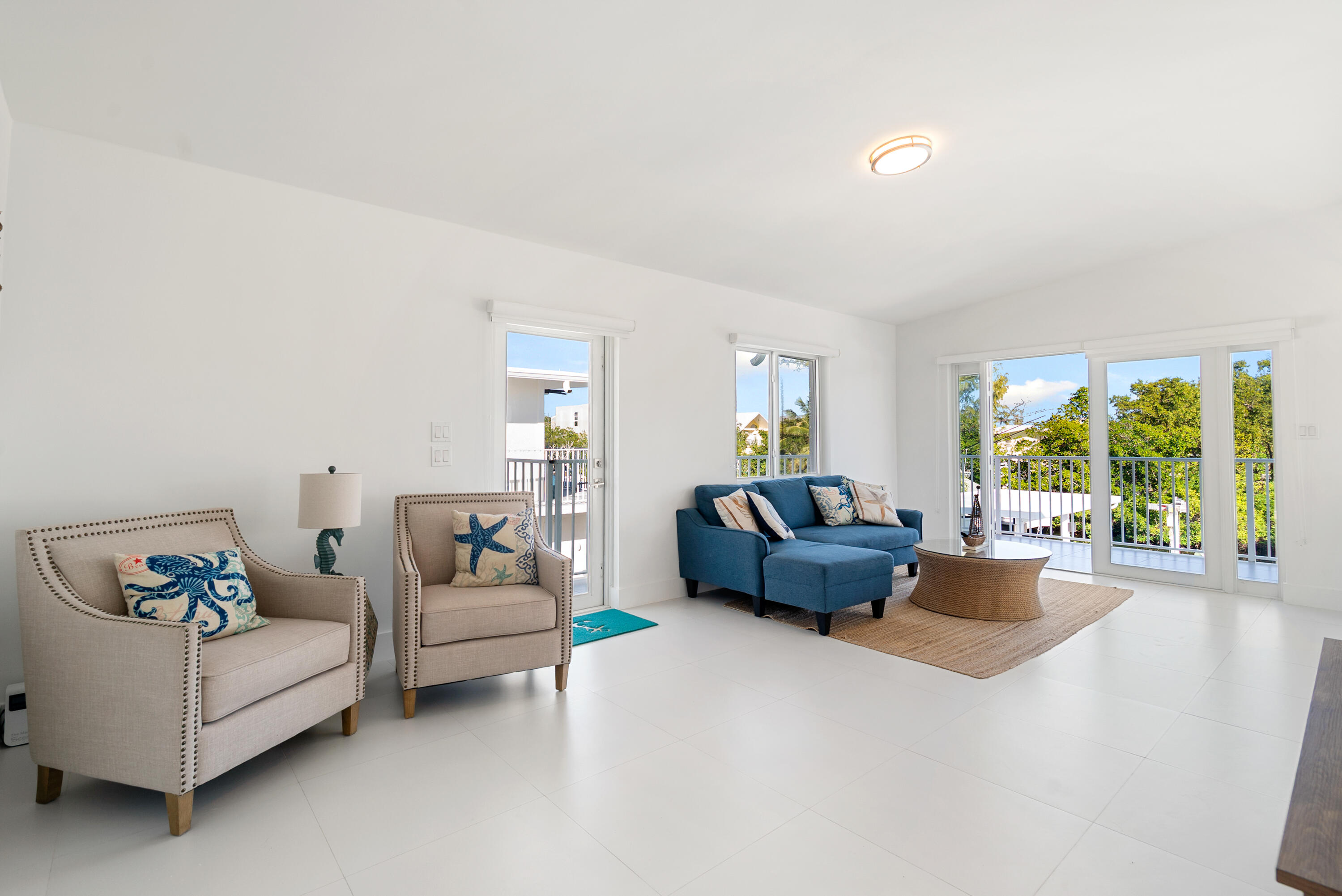204 La Paloma Road Key Largo, FL 33037 - Photo 13 of 35 a living room with furniture and a large window