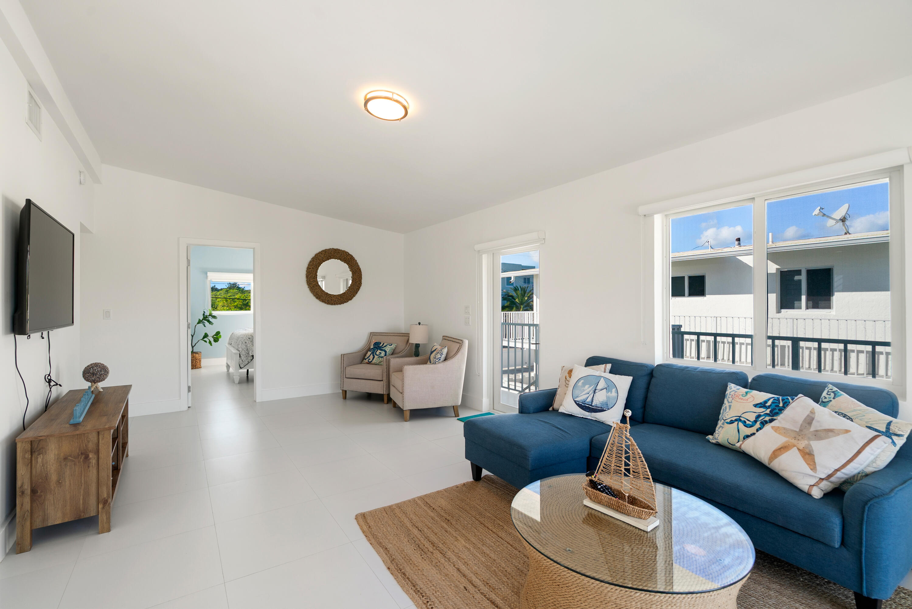 204 La Paloma Road Key Largo, FL 33037 - Photo 16 of 35 a living room with furniture and a flat screen tv