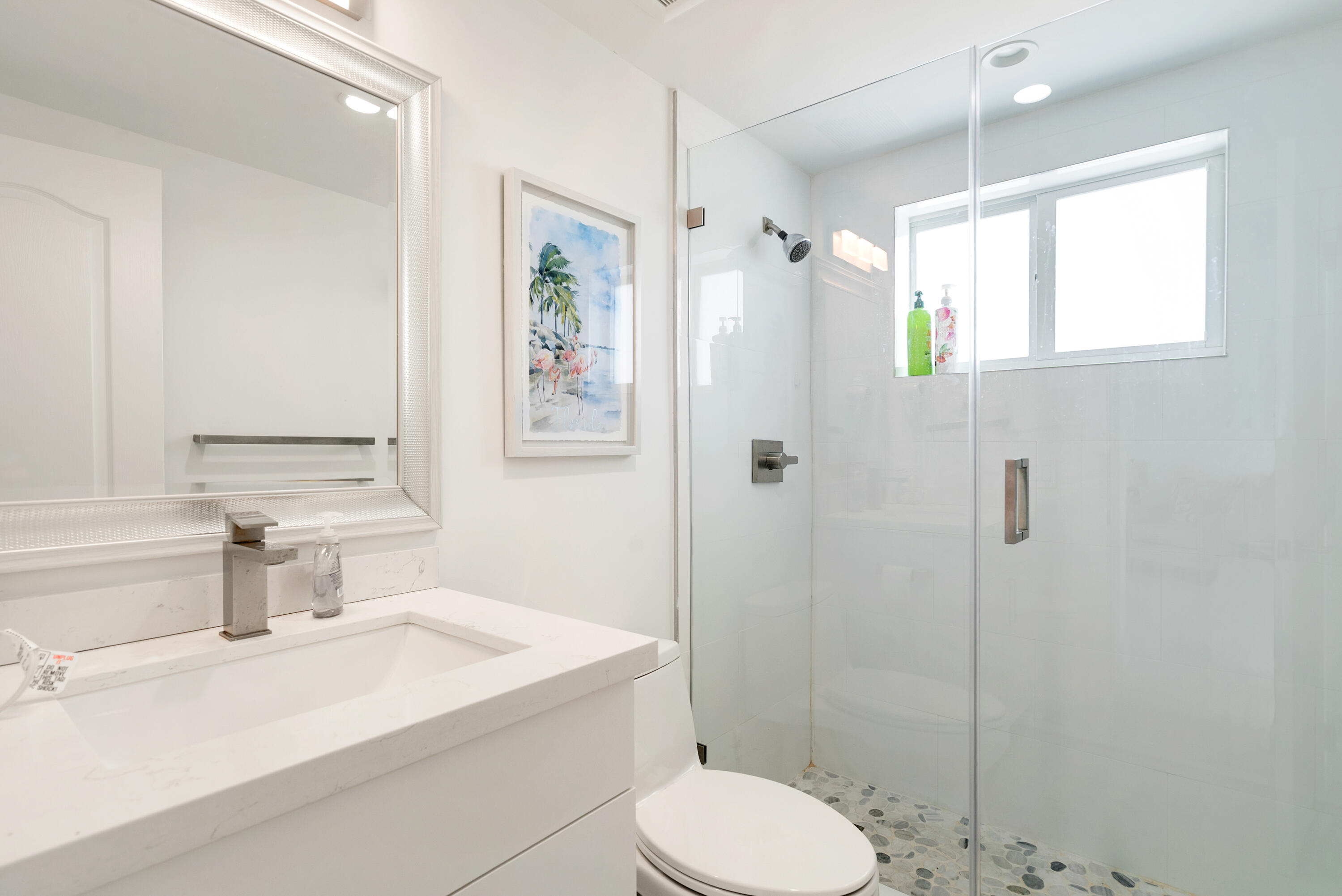 204 La Paloma Road Key Largo, FL 33037 - Photo 23 of 35 a bathroom with a sink toilet and shower