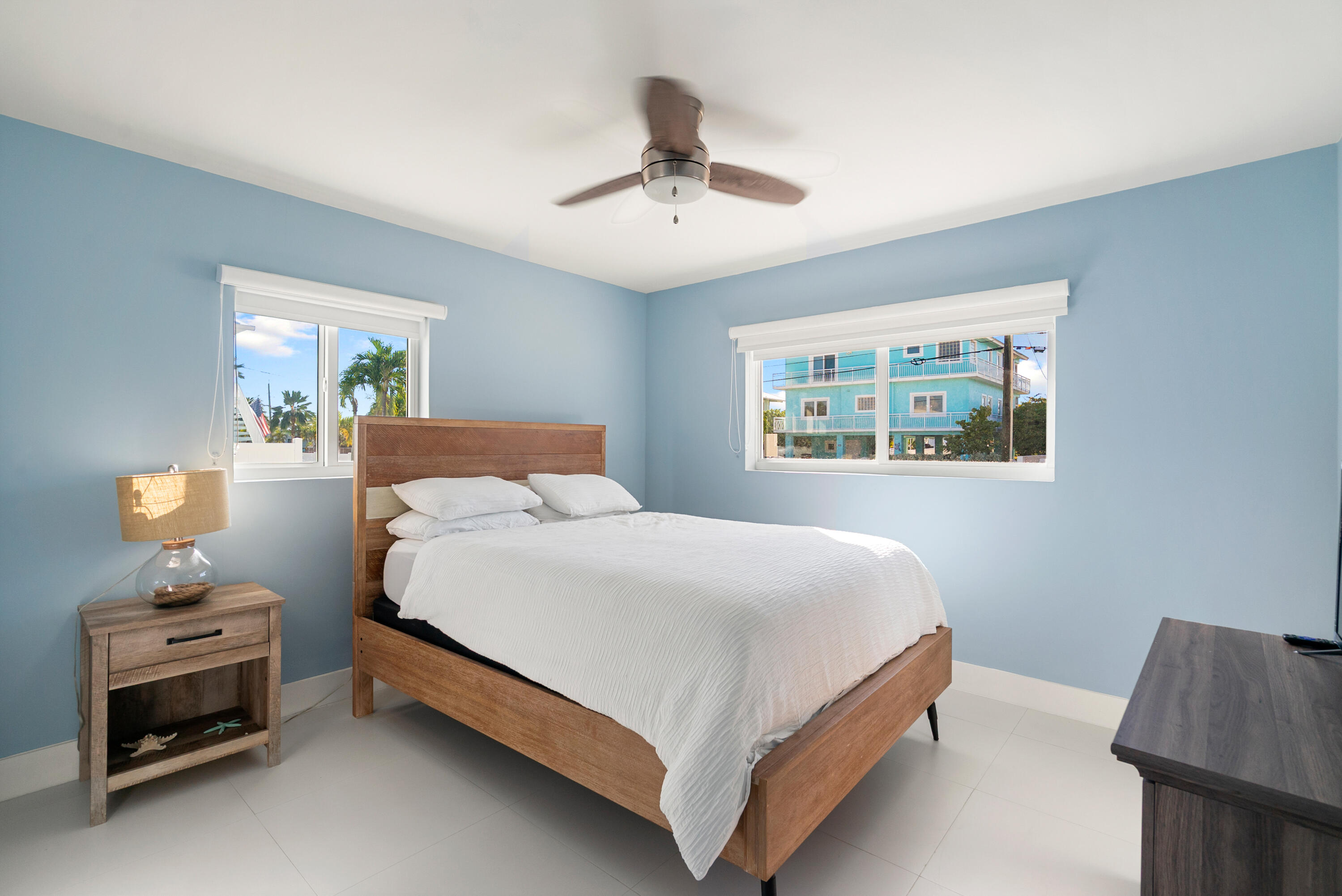 204 La Paloma Road Key Largo, FL 33037 - Photo 29 of 35 a bedroom with a bed and a window