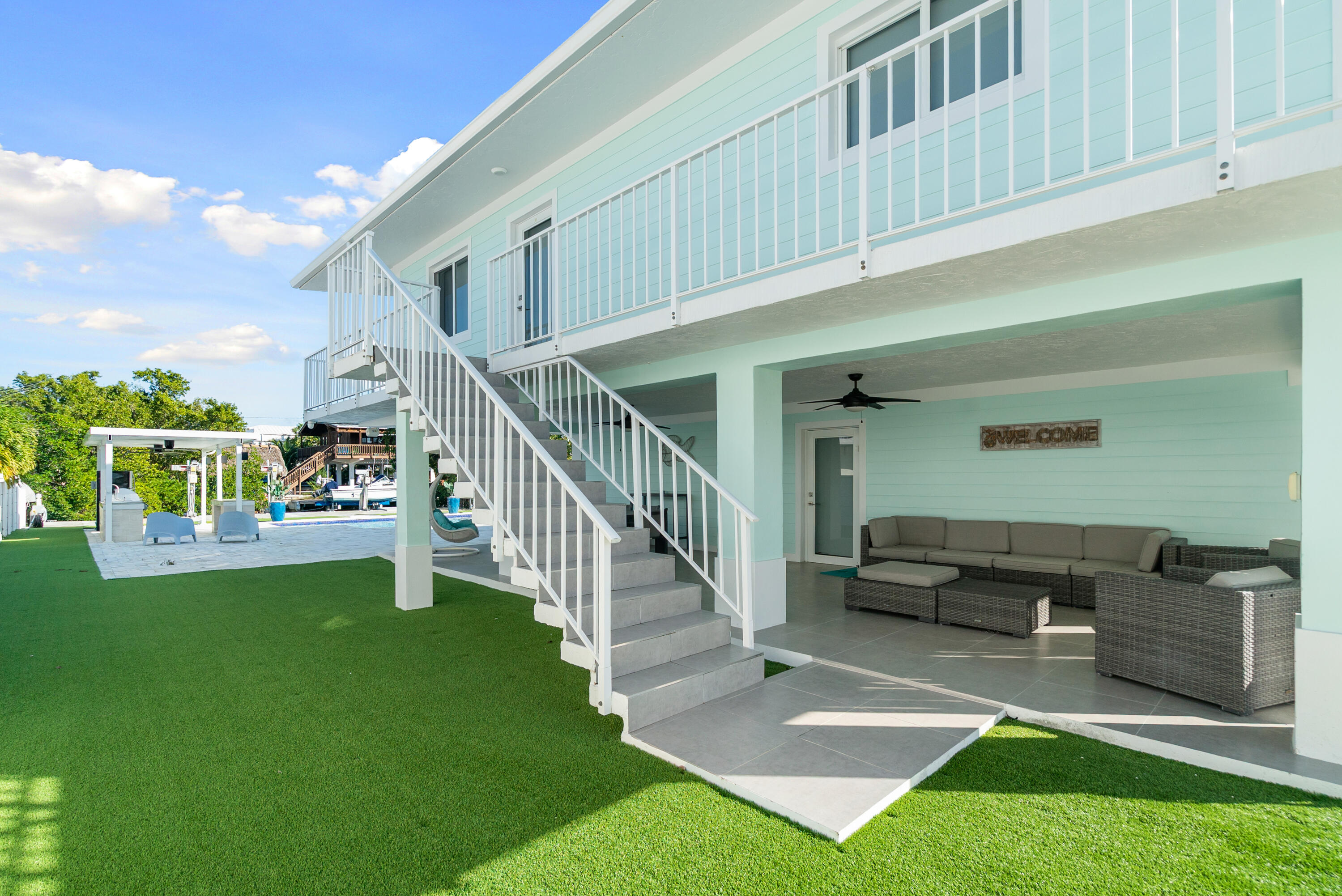 204 La Paloma Road Key Largo, FL 33037 - Photo 5 of 35 a view of a house with backyard porch and sitting area