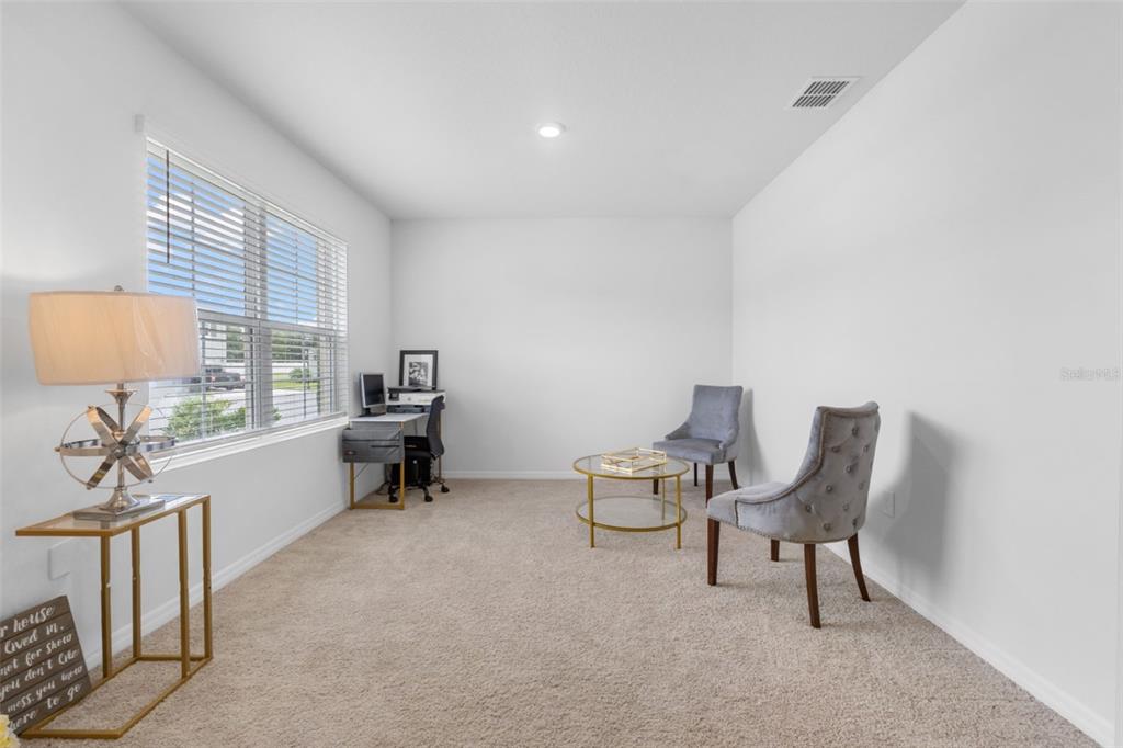 821 Sun Burst Road Winter Haven, FL 33880 - Photo 12 of 86 a view of a workspace with furniture and a window