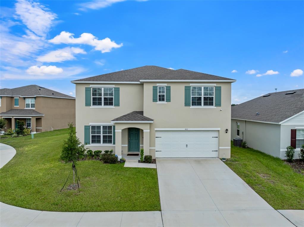 821 Sun Burst Road Winter Haven, FL 33880 - Photo 2 of 86 a front view of a house with a yard