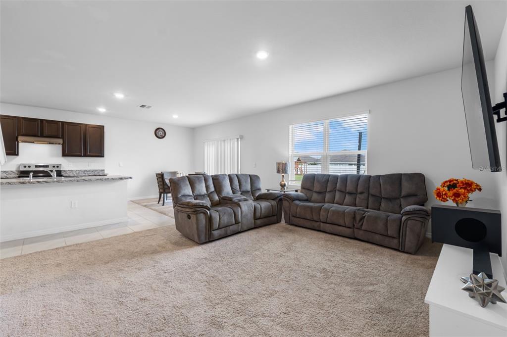821 Sun Burst Road Winter Haven, FL 33880 - Photo 27 of 86 a living room with furniture and a flat screen tv