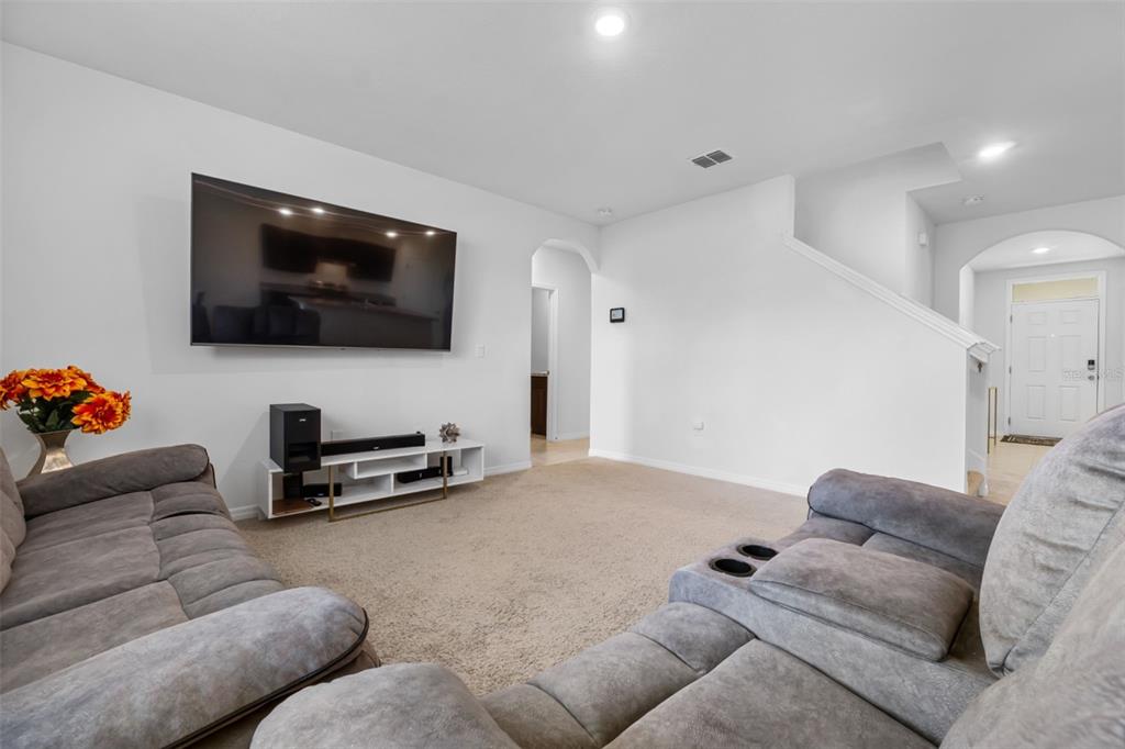821 Sun Burst Road Winter Haven, FL 33880 - Photo 29 of 86 a living room with furniture and a flat screen tv
