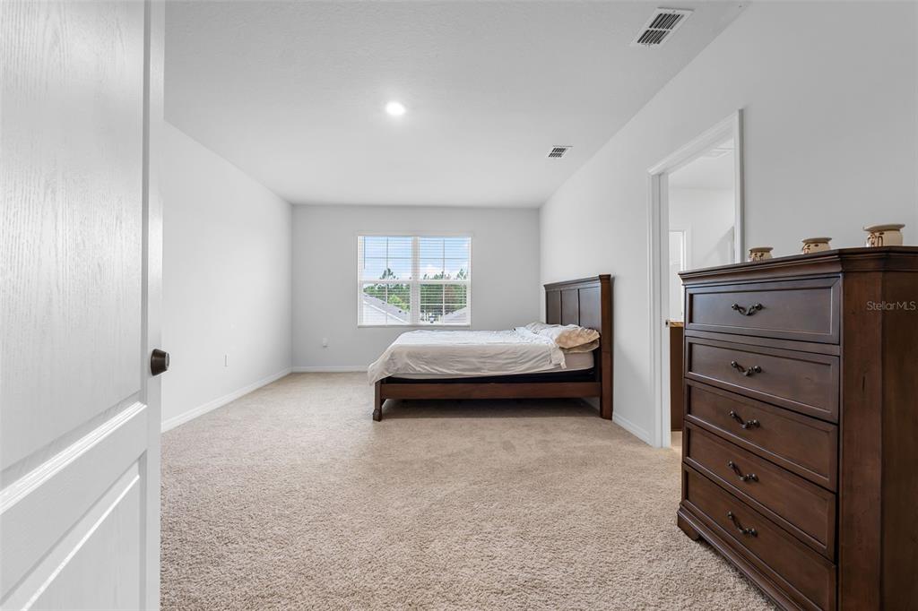 821 Sun Burst Road Winter Haven, FL 33880 - Photo 37 of 86 a bedroom with a bed and a window